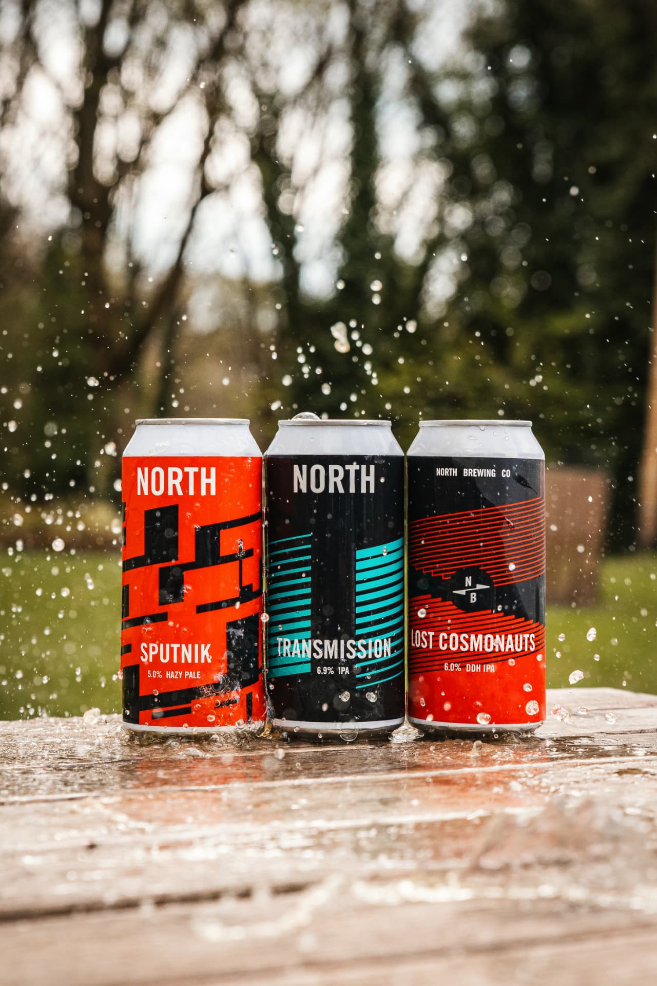 North Brewing Co. beer cans with water splash, product photography Leeds