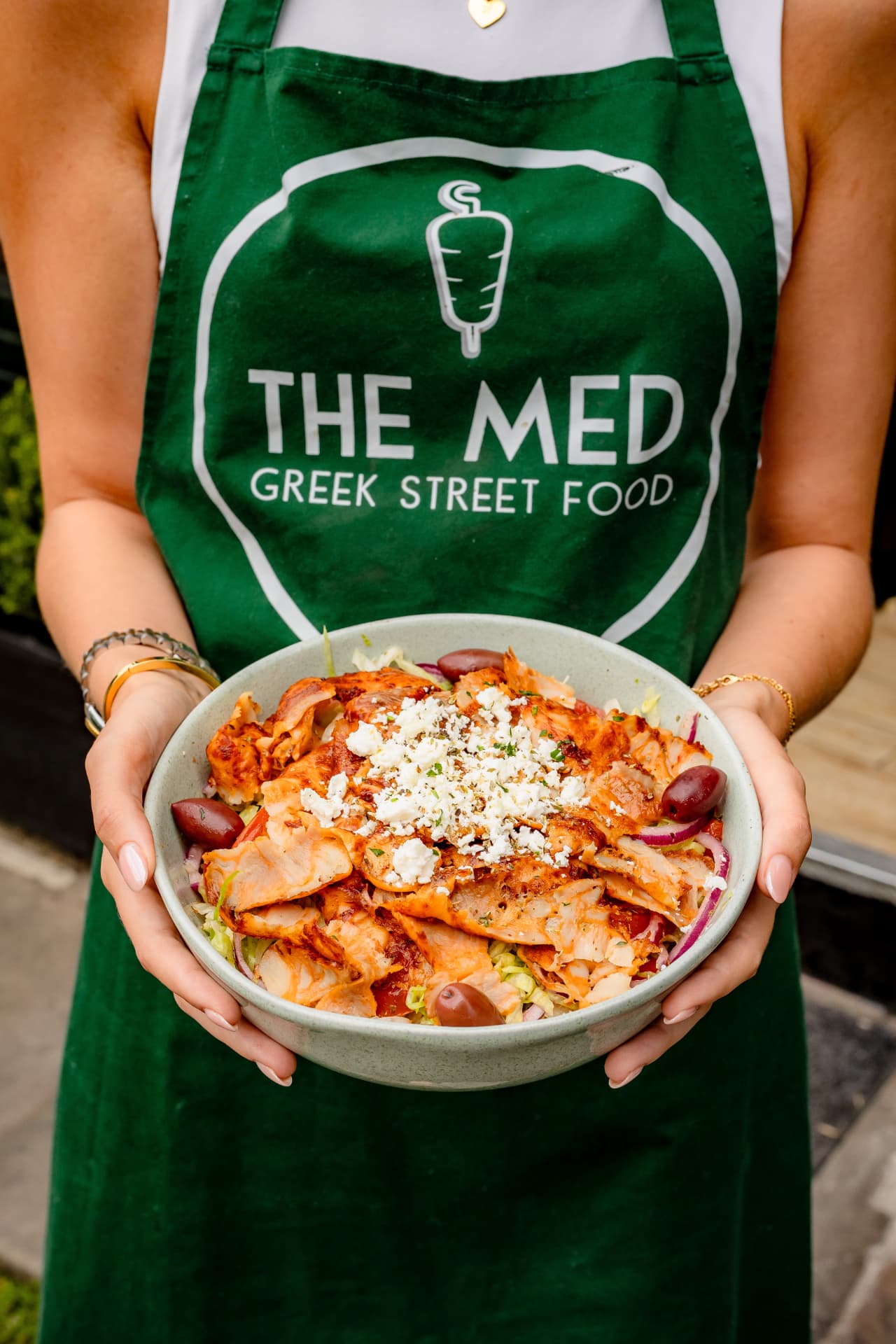 Greek chicken gyros bowl with feta and olives, food photography
